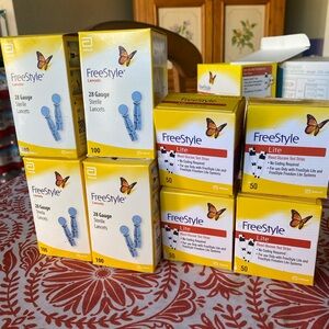 Freestyle Lancets and 50 Ct Test Strips four box of each